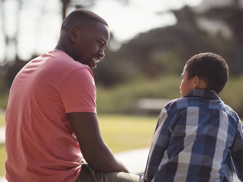 A man and young man talking